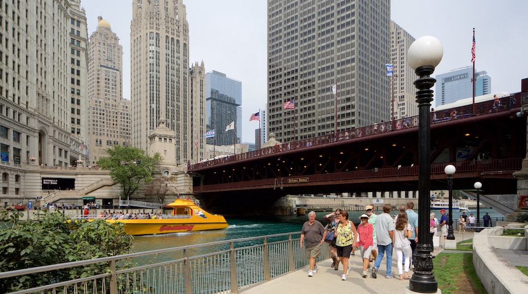 The Loop - Downtown showing a river or creek and hiking or walking as well as a large group of people