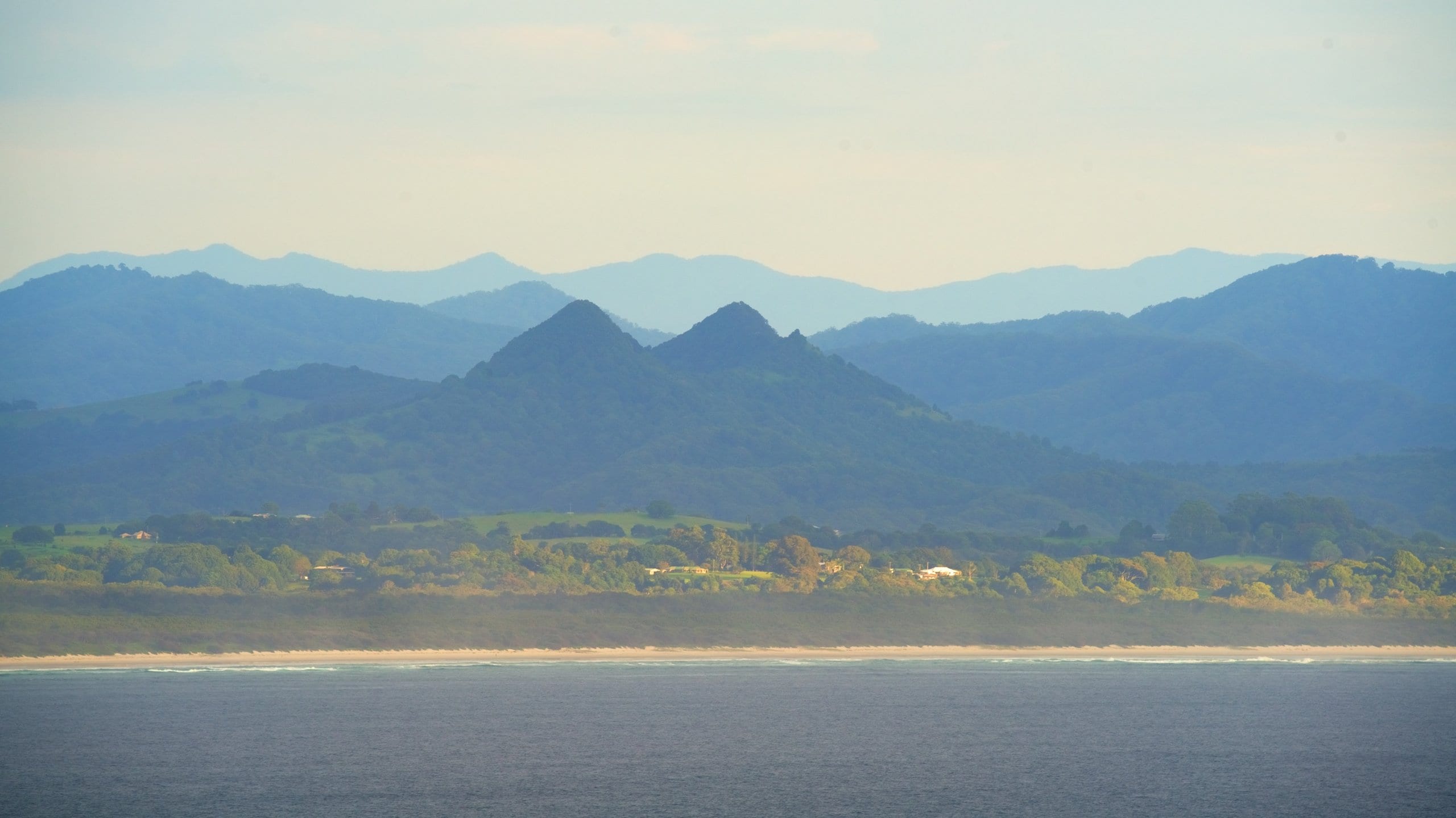 Byron Bay which includes a beach and mountains