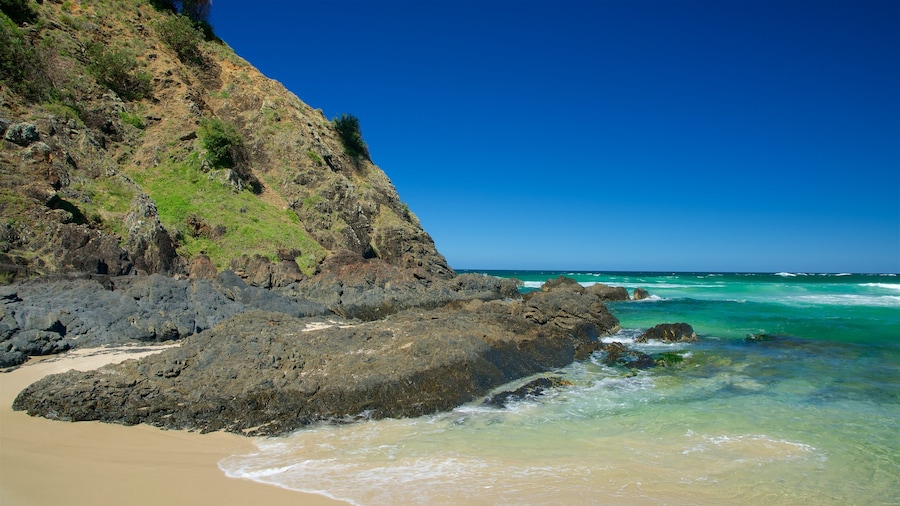 Tallow Beach showing a beach and rocky coastline