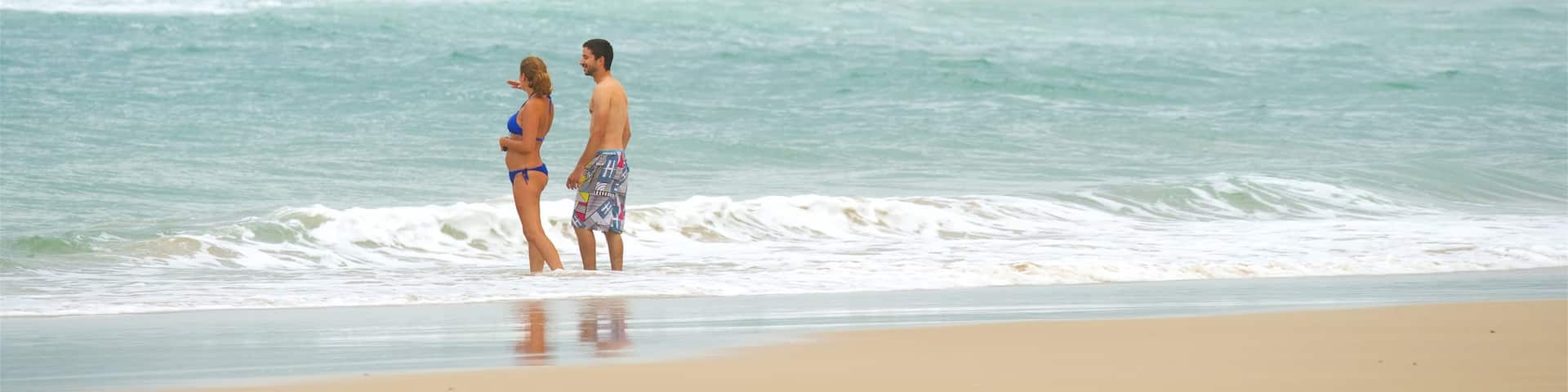 Pippi Beach featuring a sandy beach as well as a couple