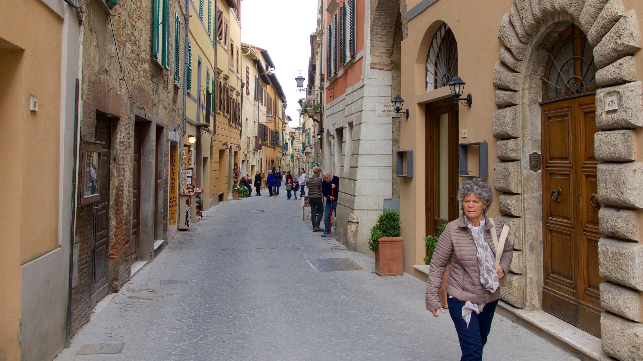 Montepulciano featuring street scenes as well as a small group of people