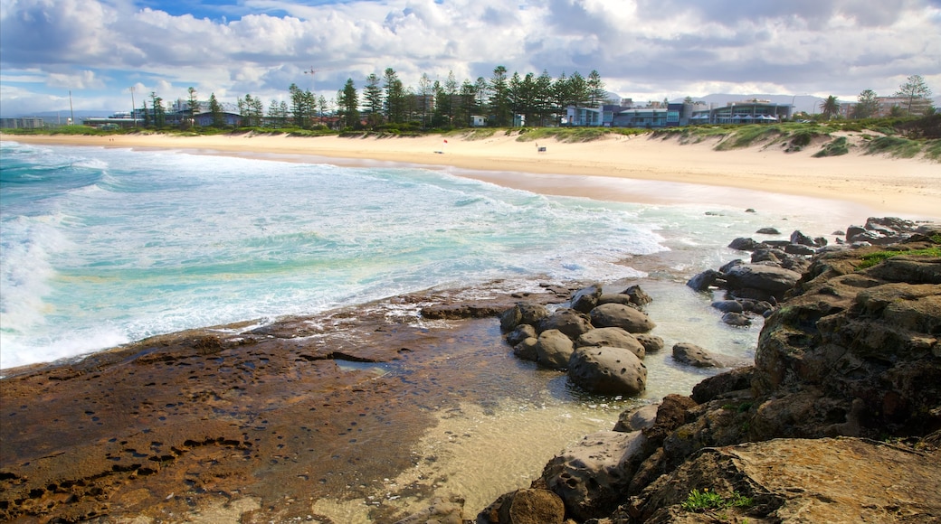 Wollongong South Beach featuring rugged coastline and a beach