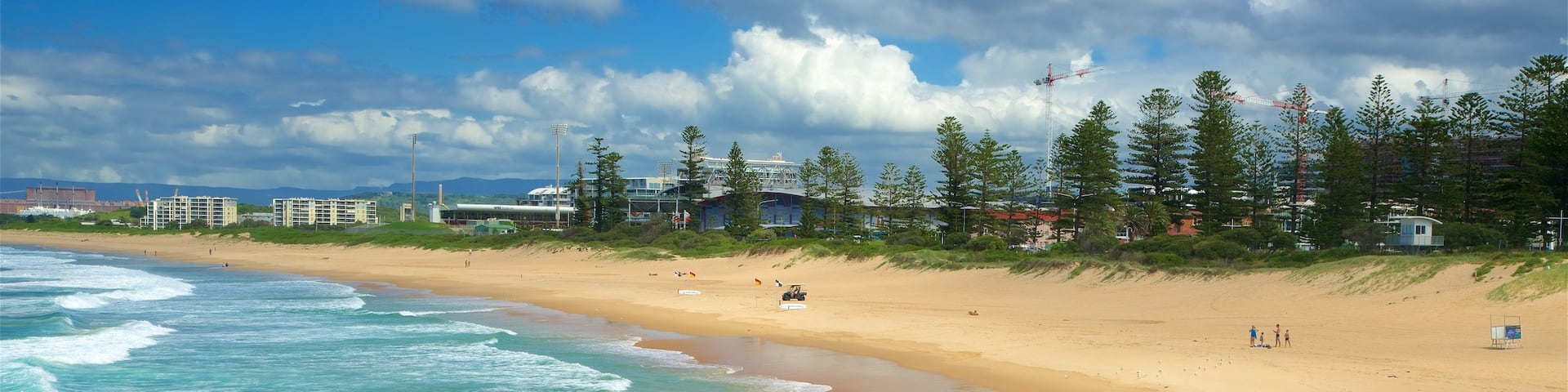 Wollongong South Beach showing rugged coastline and a sandy beach