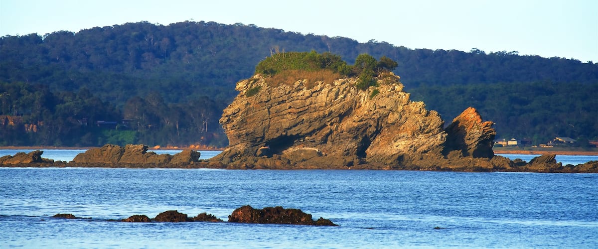 Caseys Beach which includes rugged coastline