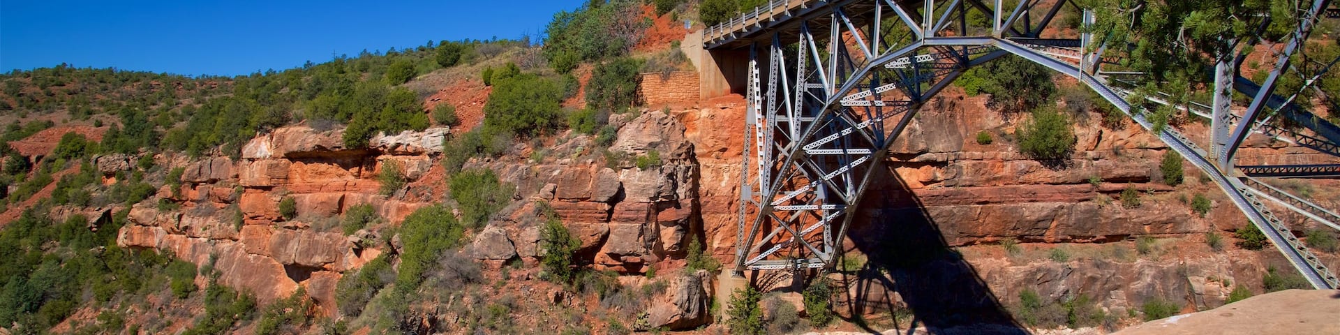 Oak Creek Canyon which includes a gorge or canyon, a bridge and tranquil scenes