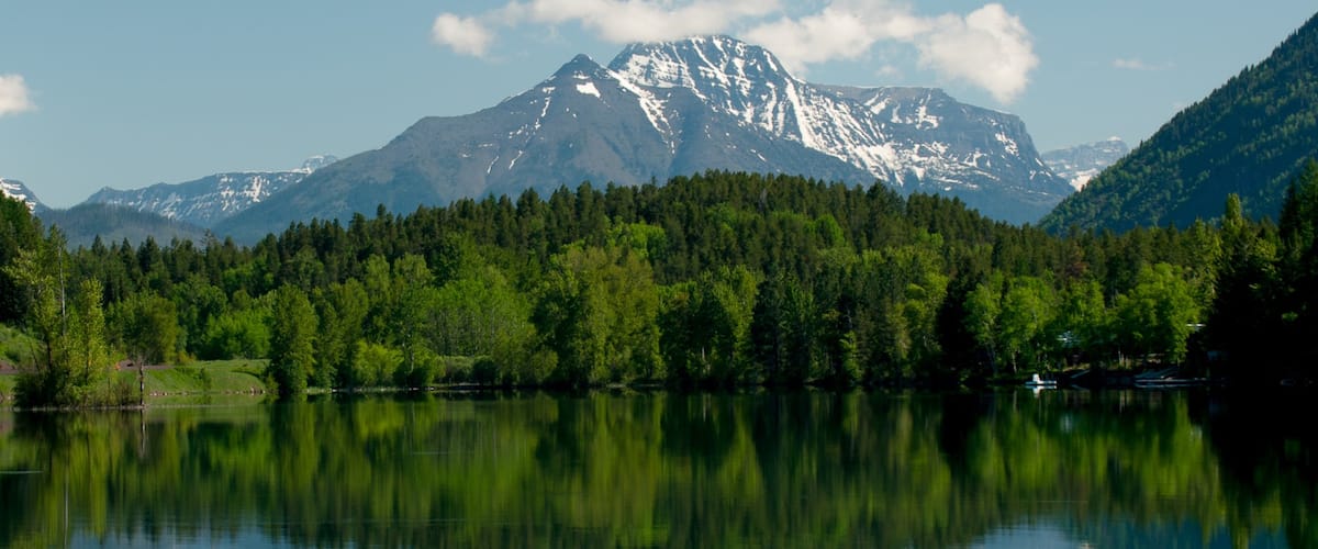Bigfork showing mountains, forest scenes and a lake or waterhole