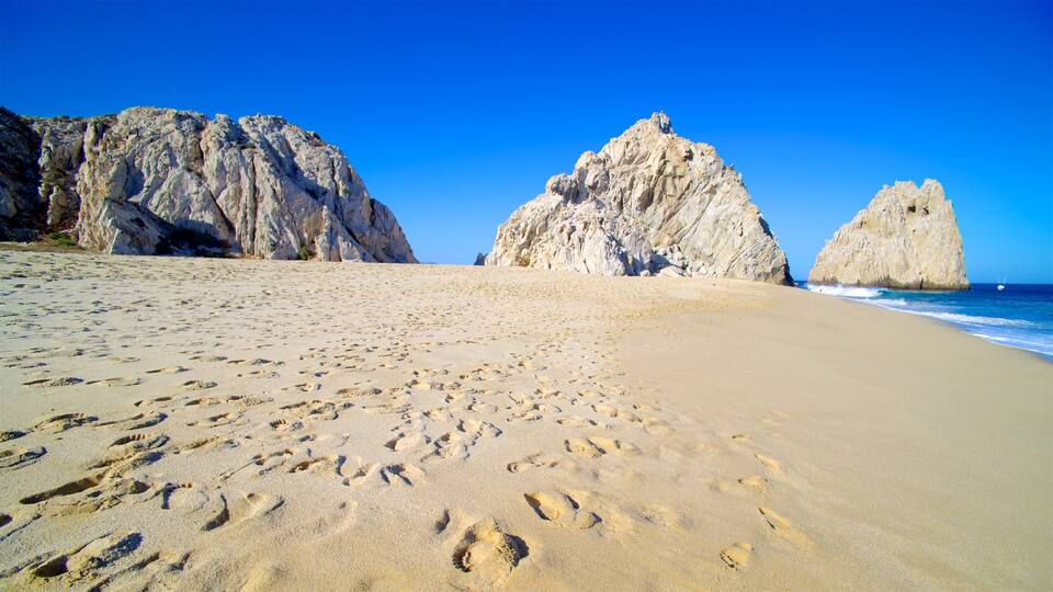 Mexico showing a sandy beach, a bay or harbor and rocky coastline