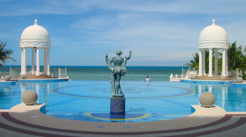 Mexico showing a statue or sculpture, a pool and a bay or harbor