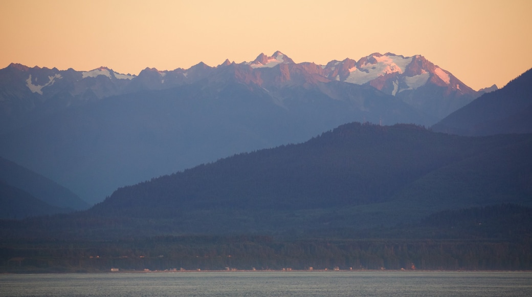 Southeast Alaska - Inside Passage which includes mountains, a bay or harbor and a sunset