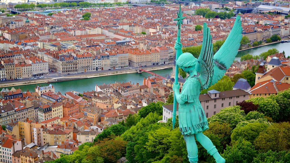 Lyon which includes a river or creek, a city and a statue or sculpture