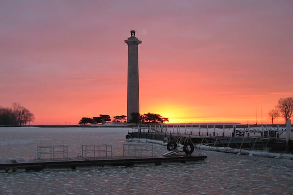 Perry\'s Victory and International Peace Memorial showing a sunset and a river or creek