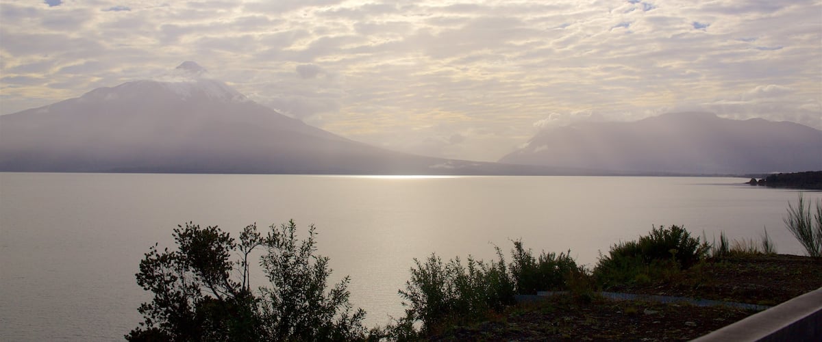 Los Lagos featuring mist or fog and a lake or waterhole