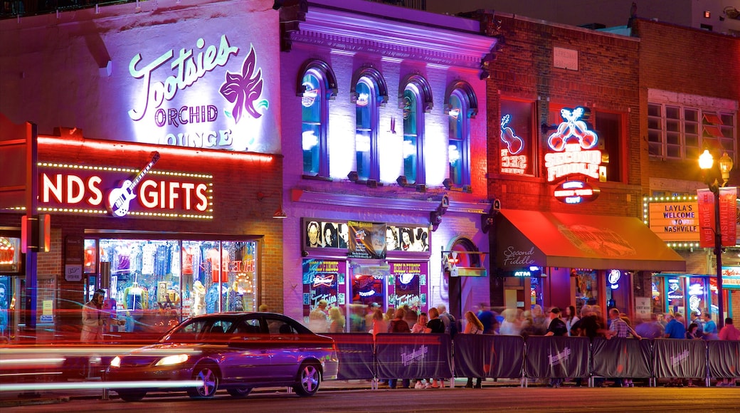 Music Row showing a city, nightlife and signage