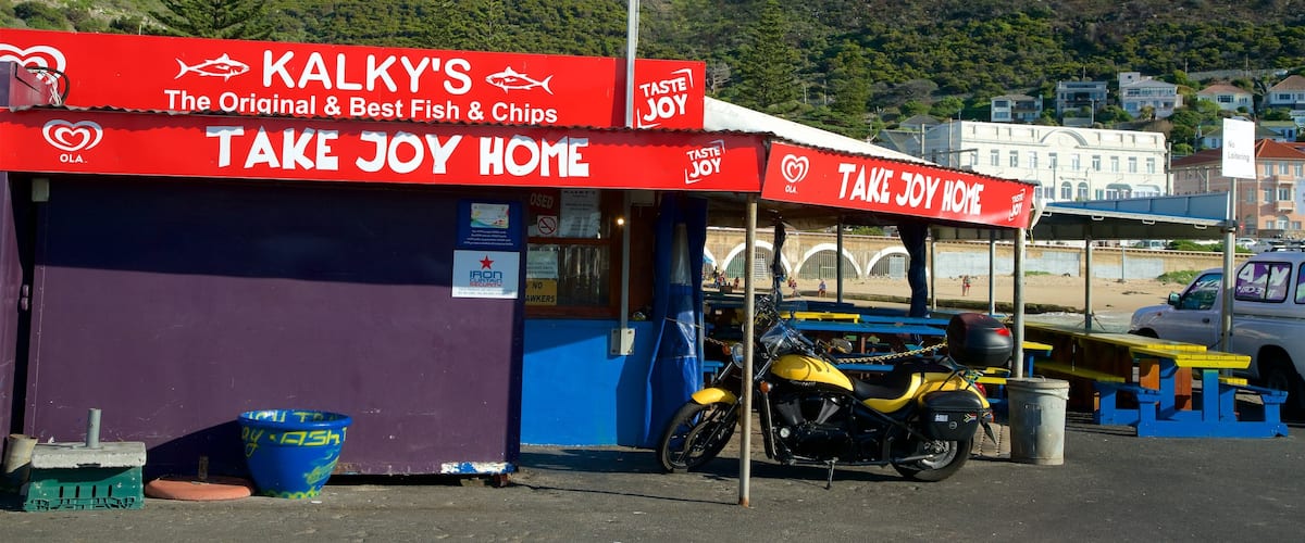 Kalk Bay featuring outdoor eating, a beach bar and signage