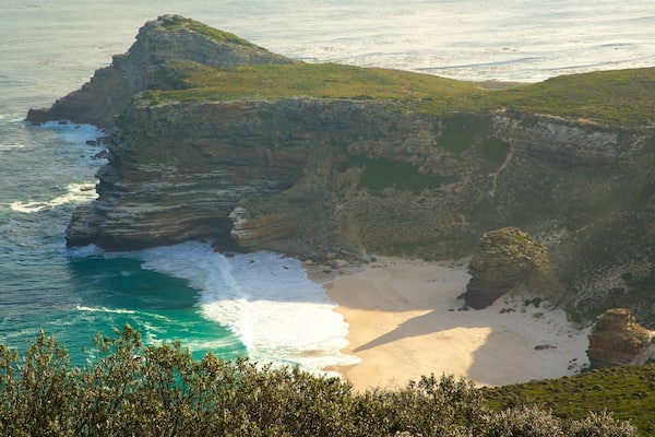 Cape Point which includes a sandy beach and rocky coastline