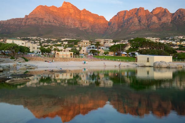 Camps Bay Beach showing a sandy beach and a coastal town