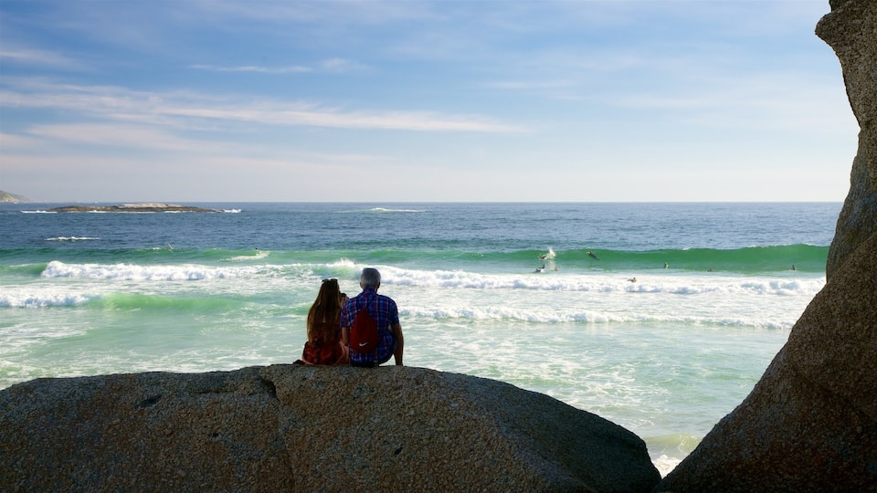 Camps Bay Beach showing a sandy beach as well as a couple