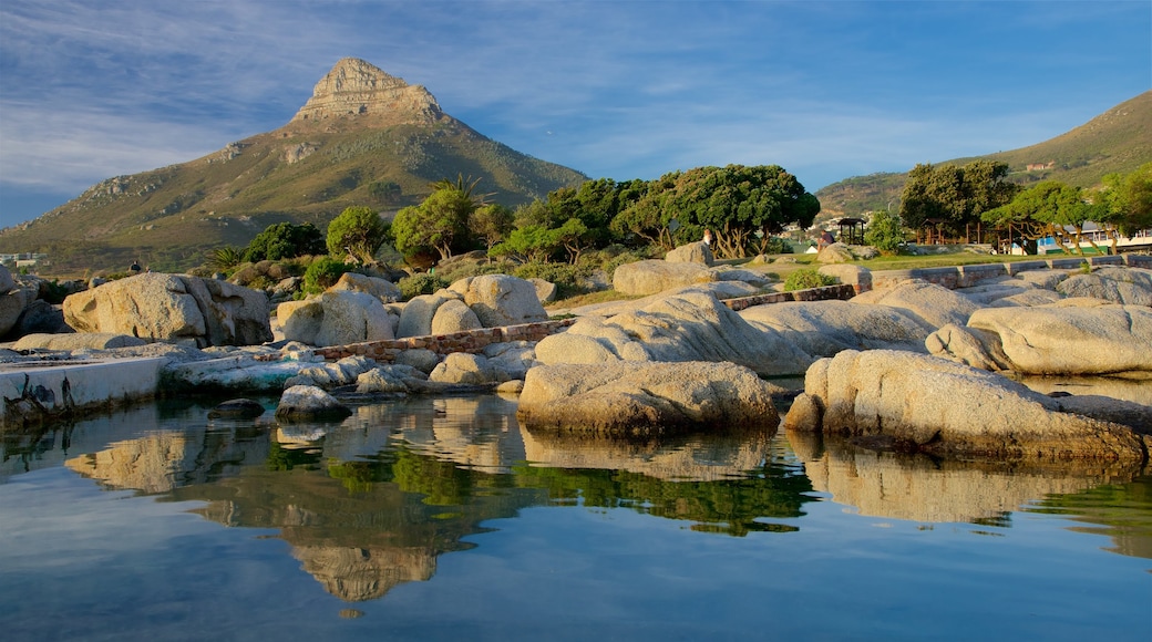 Camps Bay Beach featuring rugged coastline