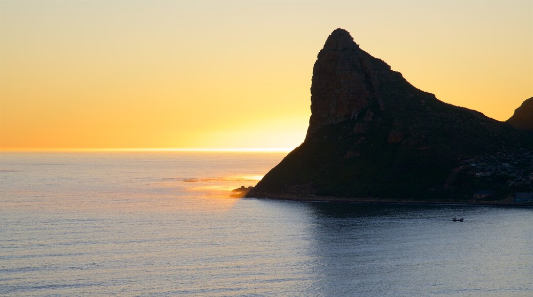 Chapmans Peak featuring a sunset and rugged coastline