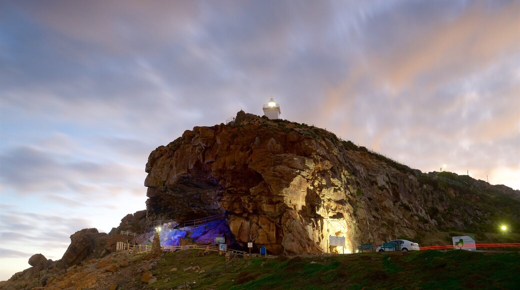 St. Blaize Lighthouse featuring rugged coastline, a lighthouse and a sunset