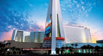 Stratosphere Tower showing a sunset, modern architecture and a city