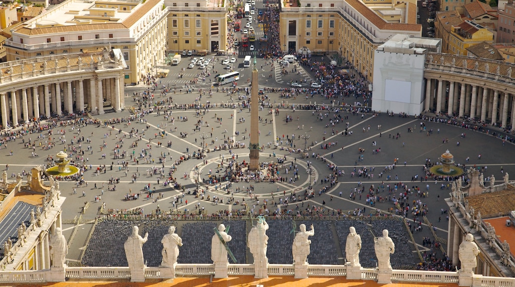 St. Peter\'s Square featuring a statue or sculpture, a city and a square or plaza