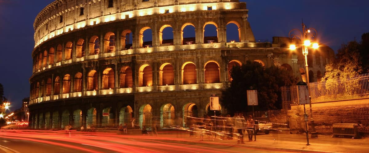 Italy which includes night scenes, heritage architecture and a city