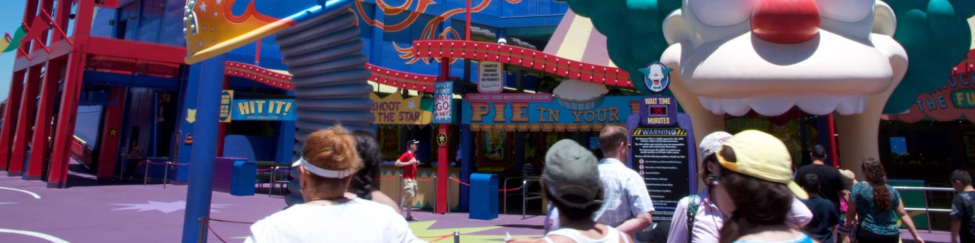 Universal Studios which includes rides, signage and a city