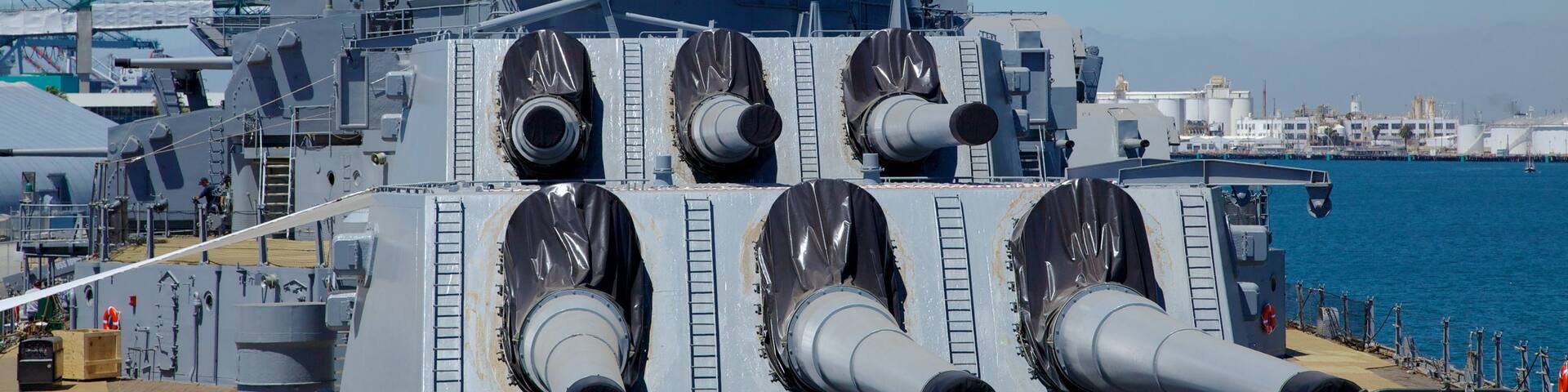 USS Iowa showing a bay or harbour, military items and skyline