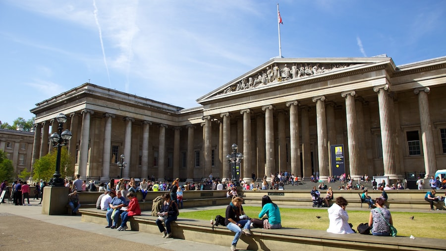 Front view of the British Museum in London, featuring its iconic neoclassical architecture and lively courtyard.