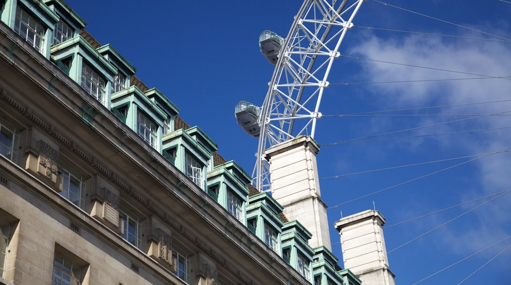 London Eye showing modern architecture, a gondola and skyline