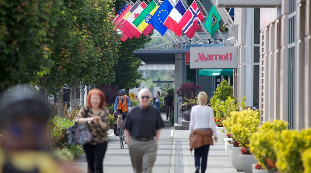 Downtown Seattle showing street scenes, signage and a hotel