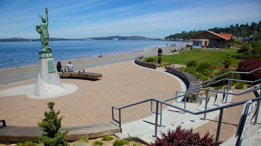 Alki Beach featuring a statue or sculpture, a monument and a square or plaza