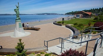 Alki Beach which includes landscape views, a memorial and a square or plaza