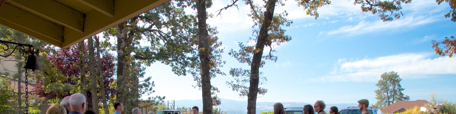 Cooper Mountain Vineyards featuring landscape views as well as a large group of people