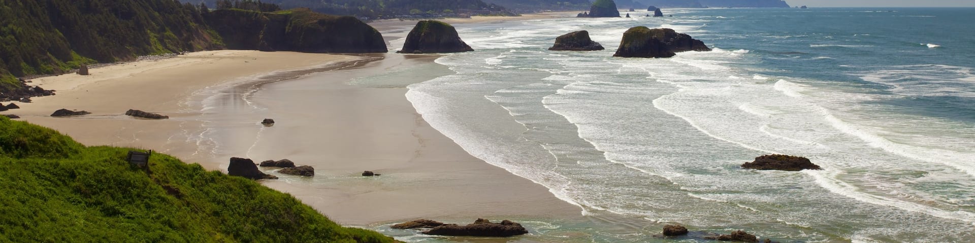 Cannon Beach featuring landscape views, mountains and a sandy beach