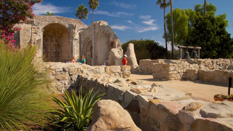 Mission San Juan Capistrano which includes heritage architecture and landscape views