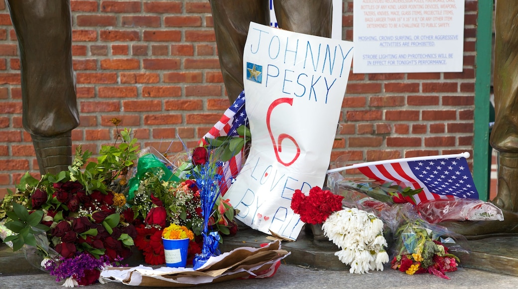 Fenway Park featuring signage and flowers