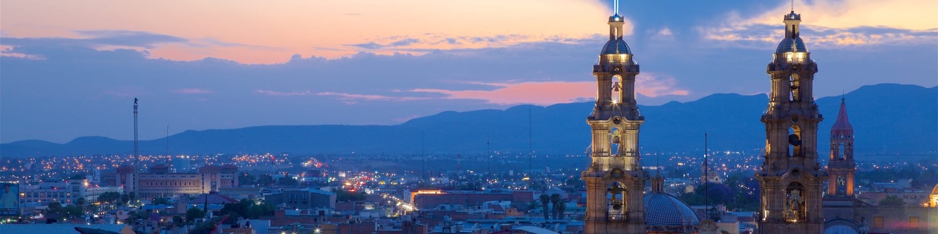 Aguascalientes featuring a sunset, a city and landscape views