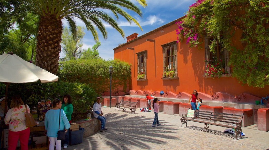 Juarez Park featuring a square or plaza as well as a small group of people