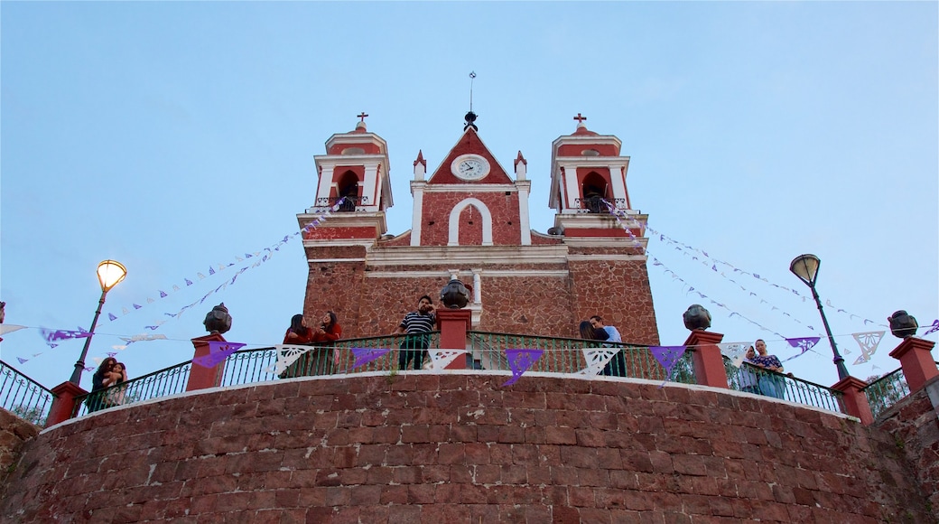 Metepec featuring a church or cathedral as well as a small group of people