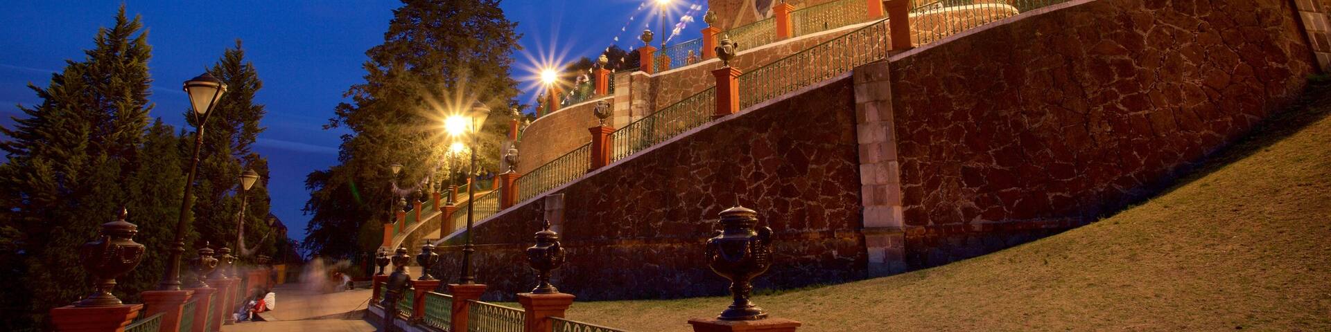 Metepec featuring a church or cathedral and night scenes