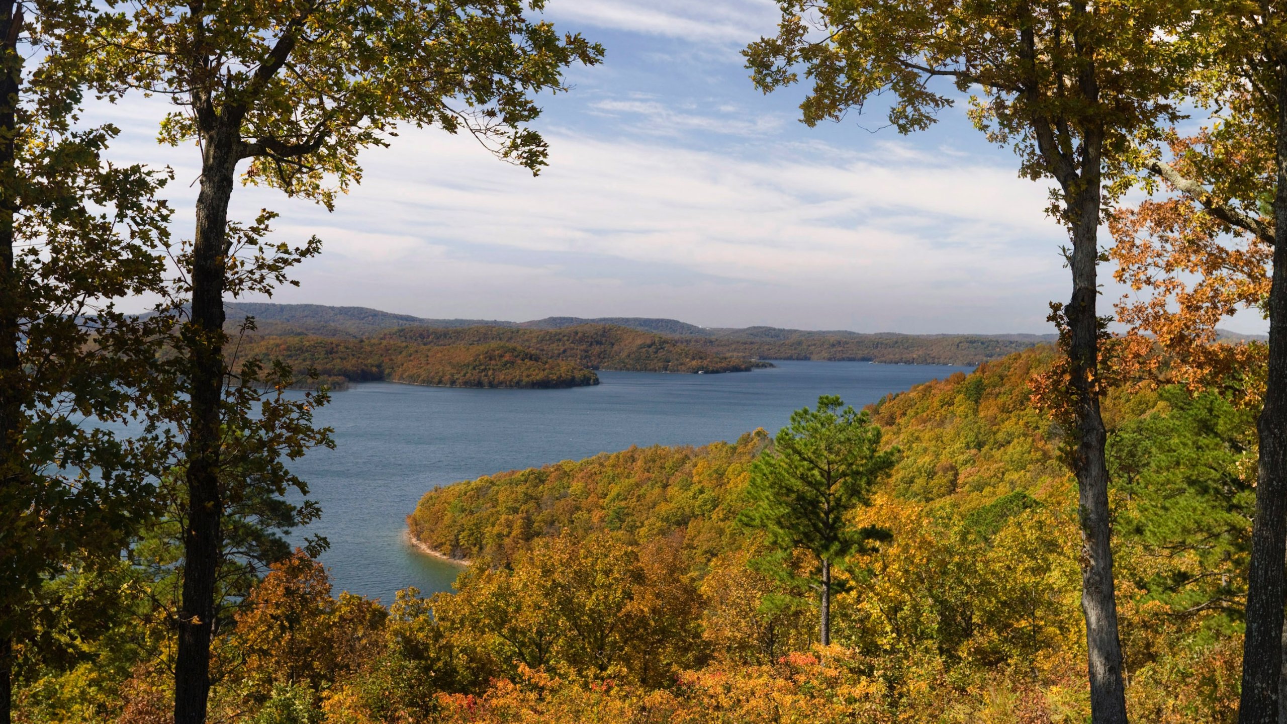 Beaver Lake which includes a lake or waterhole, forests and autumn leaves