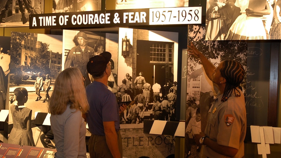 Little Rock Central High School which includes signage and interior views as well as a small group of people