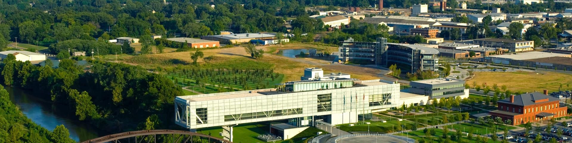 William J. Clinton Presidential Library featuring a bridge and landscape views
