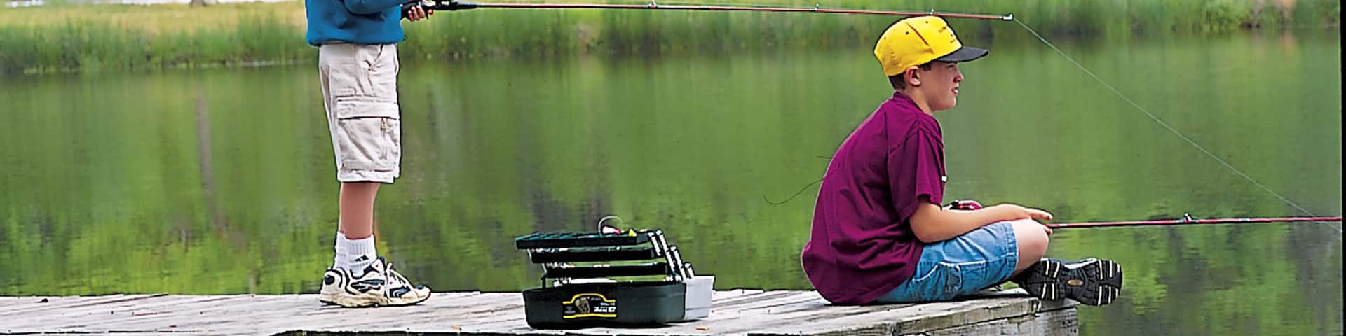 Camden featuring fishing and a lake or waterhole as well as children