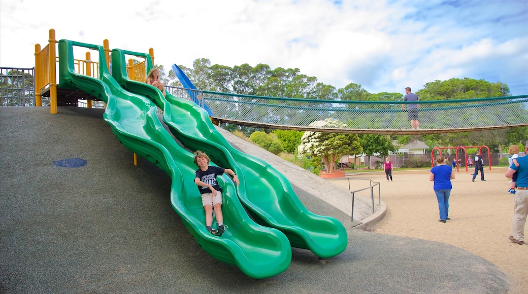 Dennis the Menace Park showing a playground as well as an individual child