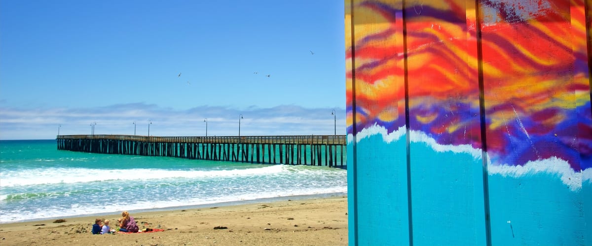 Cayucos State Beach which includes a sandy beach, general coastal views and outdoor art