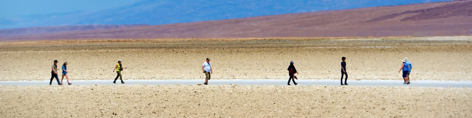 Death Valley showing desert views and tranquil scenes as well as a small group of people