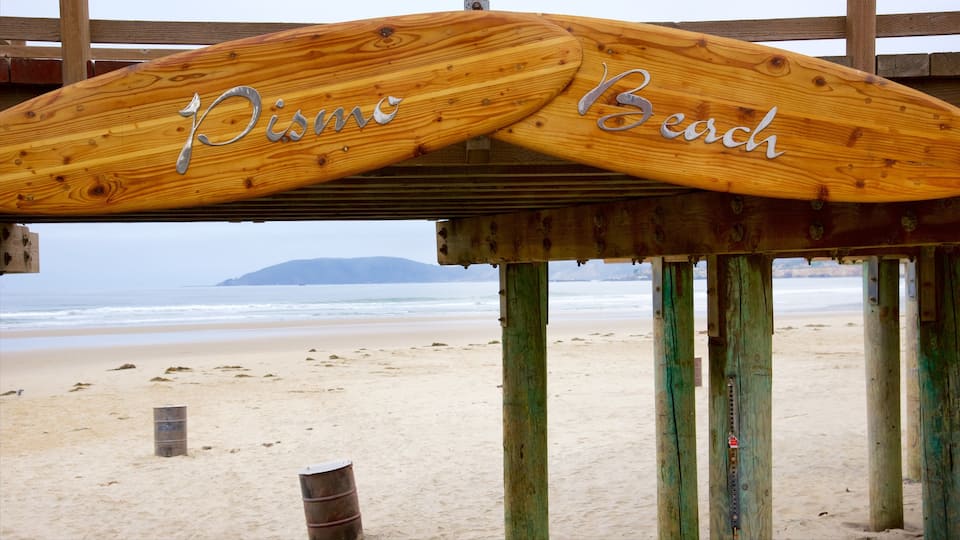 Pismo Beach which includes signage and a beach